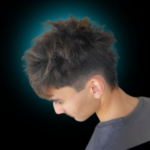 Side view of a men's modern hairstyle featuring a textured, spiky top with dark brown hair and a sharp undercut fade. High-contrast studio lighting with a soft teal aura on a black background.